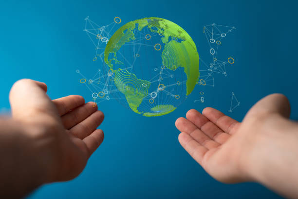 istock Person's outstretched hands pointing the 3D rendered transparent globe - renewable energy concept 1454804031