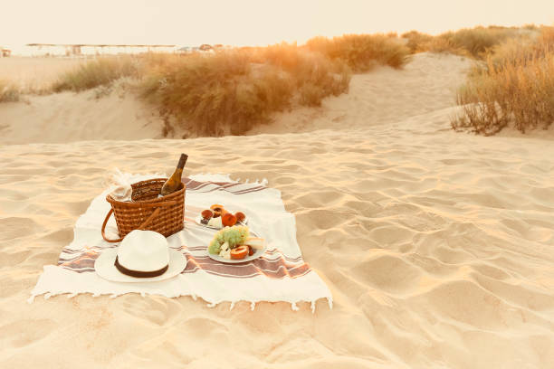 istock Wine and fruits on beach 1454804170