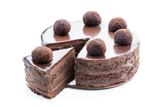 istock Tasty chocolate cake decorated with truffle isolated on white 1454806147
