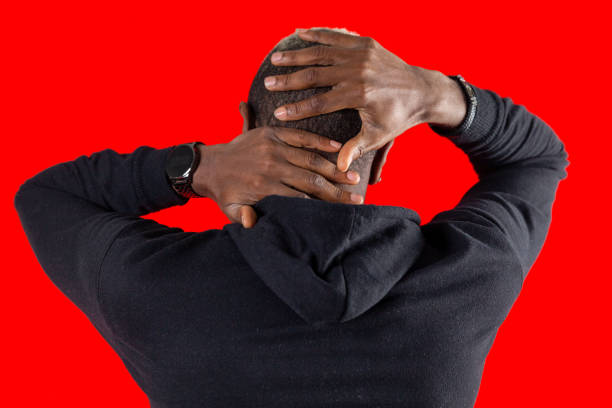 istock Portrait of rear view afro men hands behind head 1454808899