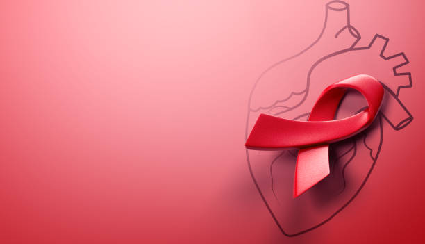 red awareness ribbon with line heart organ, heart disease awareness campaign, cardiovascular health, Stroke Prevention, hypertension (high blood pressure) for heart disease concept stock photo