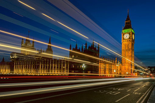 Big Ben and the Houses of Parliament in the evening incorporating the light trails over Tower Bridge