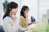 A woman responding to a customer at a call center