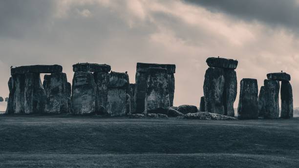 istock Landscape scene of Stonehenge monument in England under dramatic cloudy sky 1454819899
