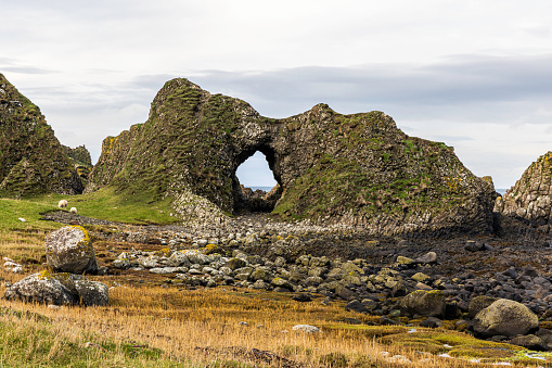A sea arch on the Antrim Coast, County Antrim,  Northern Ireland, UK.