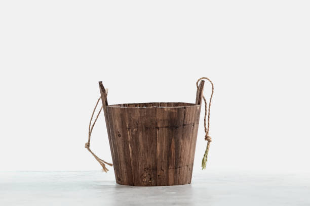 Traditional wooden bucket isolated on white background stock photo