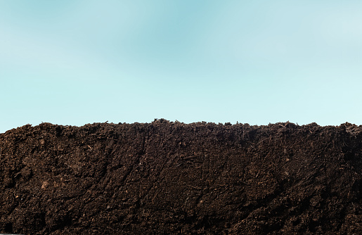 Soil or dirt section with sky