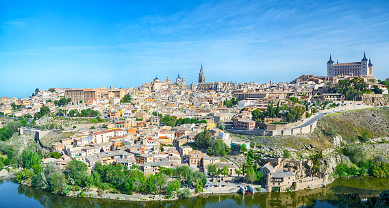 Toledo Cityscape with the Alcazar fortress and the Tagus River, Spain. Composite photo