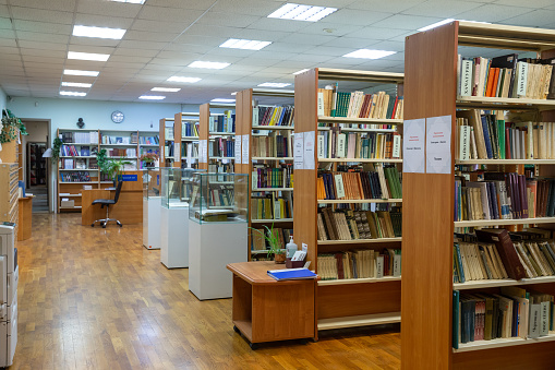 Helsinki, Finland- March 22 2019: New Helsinki central library Oodi interior. Light and spacious modern northern architecture. Bookshelves, working space. People reading, working, relaxing, studying.