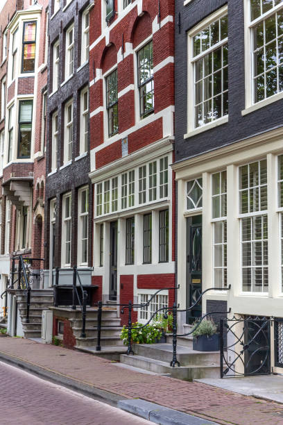 istock Street lined with typical Amsterdam houses. 1454827812