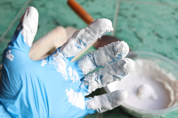 istock mixing grout in a bucket for mechanic work 1454828217