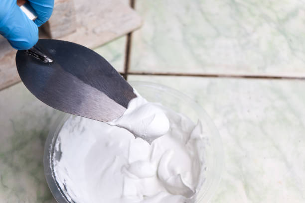 istock mixing grout in a bucket for mechanic work 1454828261