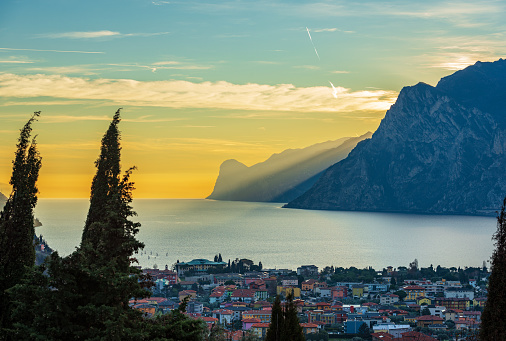 Lake Garda (Lago di Garda) and Italian Alps view from the small village of Nago-Torbole at sunset, Trento province, Trentino Alto Adige, Italy, Europe. On background the coast of Lombardy.
