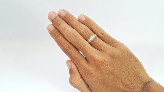 Male right hand with a ring on the ring finger