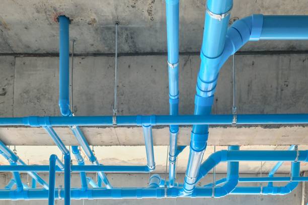 istock Low angle shot of industrial blue pipes on a ceiling 1454833325