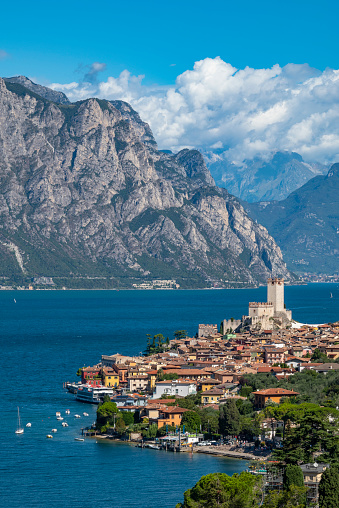 Malcesine village on the east bank of lake Garda with the European Alps in the background.