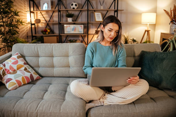 Woman using Laptop at home