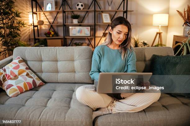 Woman Using Laptop At Home Stock Photo - Download Image Now - People, One Person, Computer