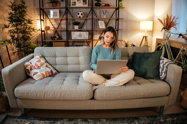 istock Woman using Laptop at home 1454837780