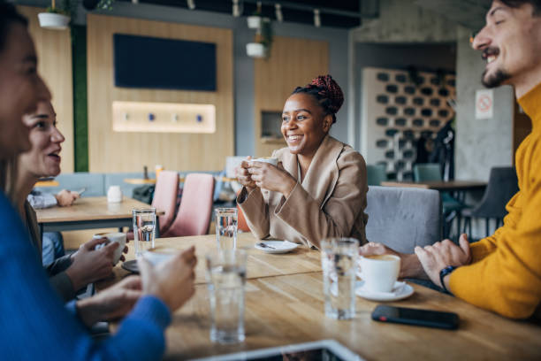 istock Friends sitting in coffee shop 1454845524