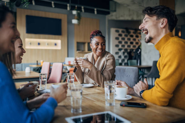 istock Friends sitting in coffee shop 1454845550