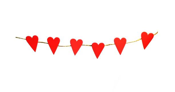 istock red hearts hanging on a rope for Valentines day 1454845656