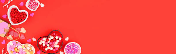 istock Valentines Day candy corner border on a red banner background 1454845999