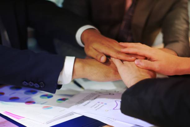 istock Business man joining hands together, teamwork concept 1454846114