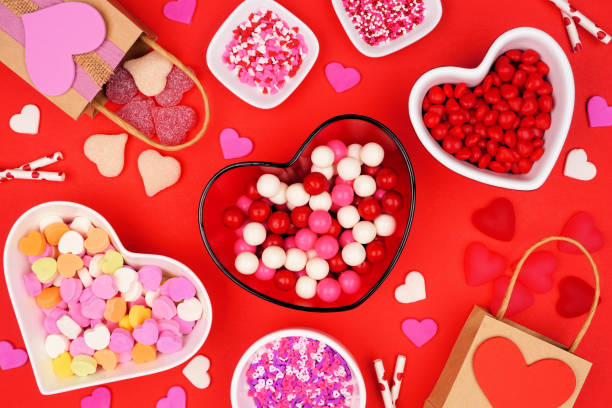 istock Valentines Day candy table scene with a selection of sweets on a red background 1454846682