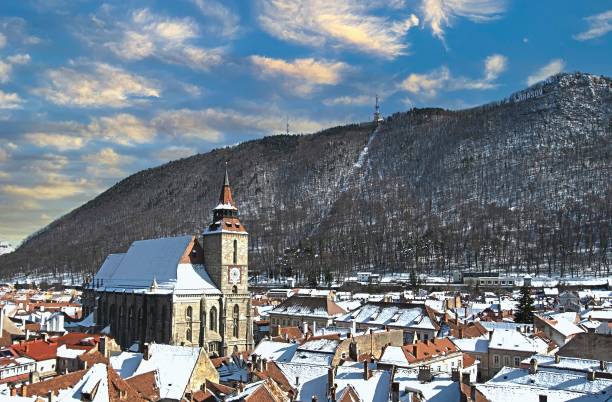 istock Black Church covered in snow on a sunny morning 1454846762