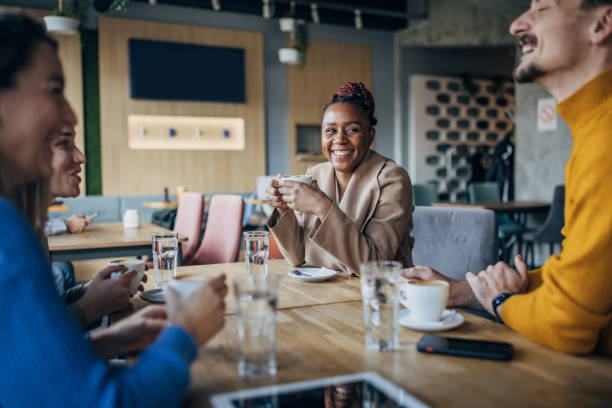 istock Friends sitting in coffee shop 1454846783