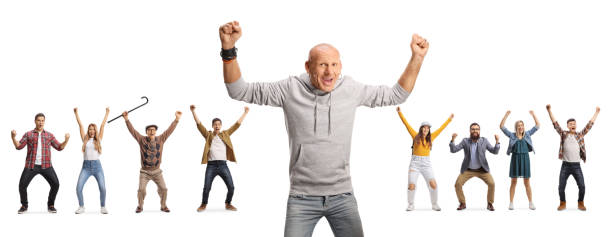 istock Bald man gesturing happiness and group of people cheering in the back 1454847755