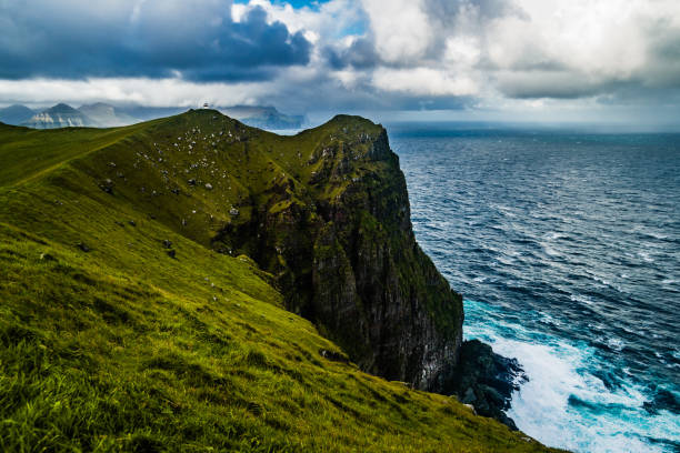 istock View on Kallur lighthouse at Kalsoy island at summer, Faroe Islands. 1454850453