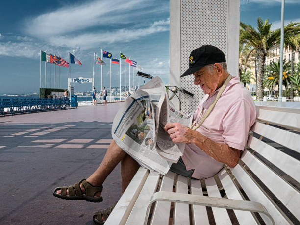 Reading on a bench stock photo