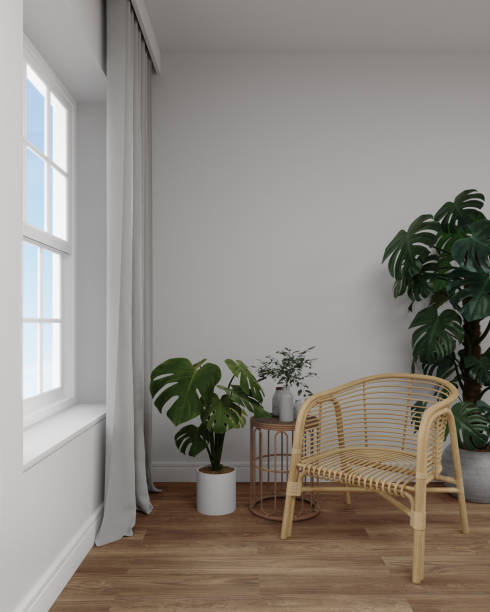 istock Empty white wall with rattan chair and table. 1454854167