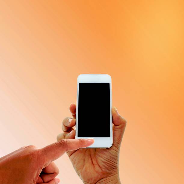 istock hand hold and touch screen smart phone 1454854360