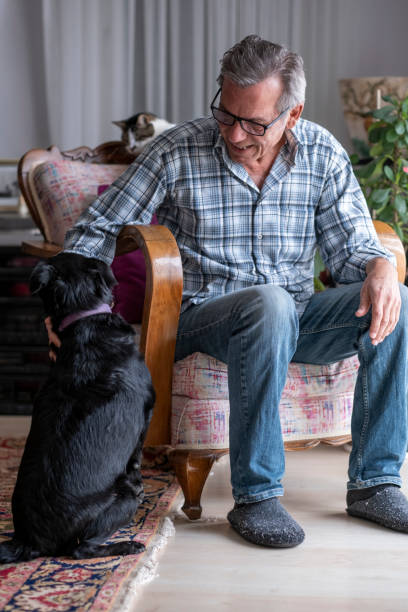 istock old man loves his pet dog 1454854574