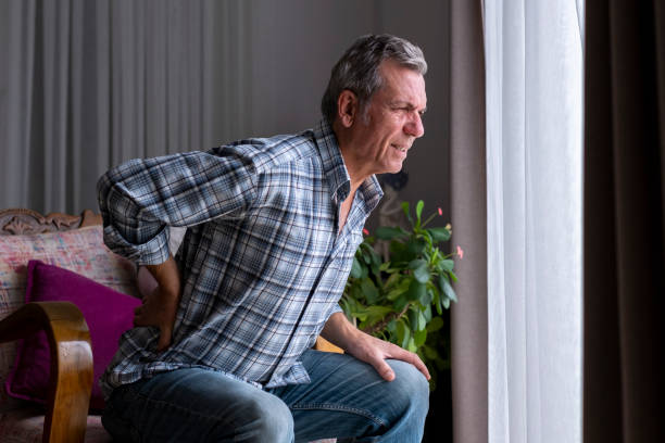 istock Old man's hand on his back , Back pain 1454854589