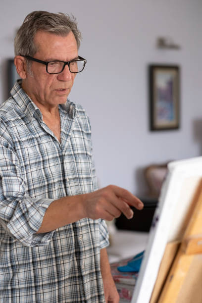 istock Portrait of old man drawing 1454854592