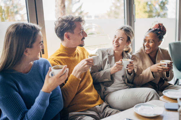 istock Modern friends sitting in cafe 1454854593