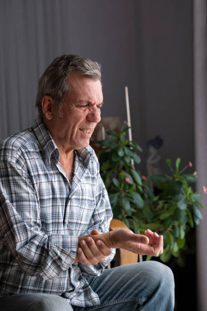 istock old man suffering from wrist pain 1454854595