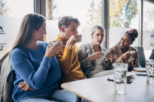 istock Modern friends in cafe 1454854650