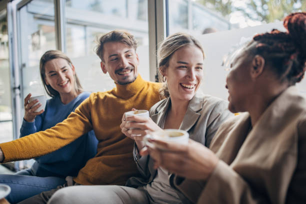 istock Modern friends sitting in cafe 1454854897