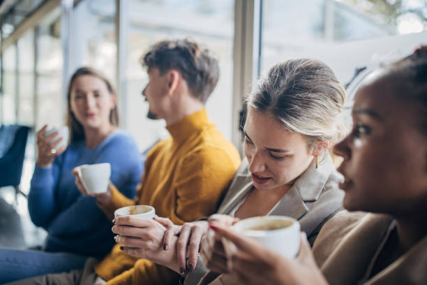 istock Modern friends in coffee shop 1454855010