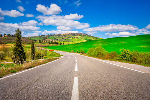 Road to Pienza historic village. Spring landscape in Val d'Orcia. Siena province, Tuscany region, Italy, Europe.