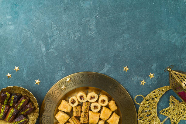 istock Ramadan kareem holiday background with dried dates, Ramadan sweets and decorations. Top view, flat lay 1454858973