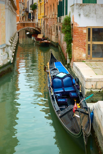 istock Parked gondola on canal in Venice 1454859707