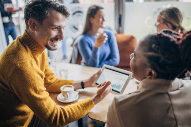 istock Young business people in cafe 1454860047
