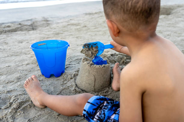 istock Child building a sand castle on the beach 1454860149