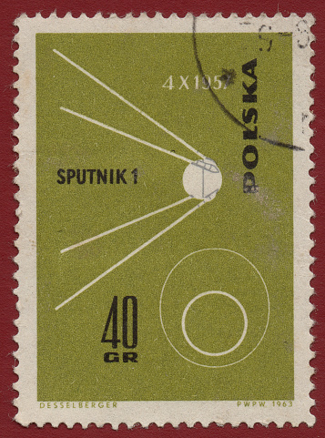 POLAND - CIRCA 1963: A stamp printed by Poland shows that Sputnik 1 was the first artificial Earth satellite launched by the USSR, circa 1963.